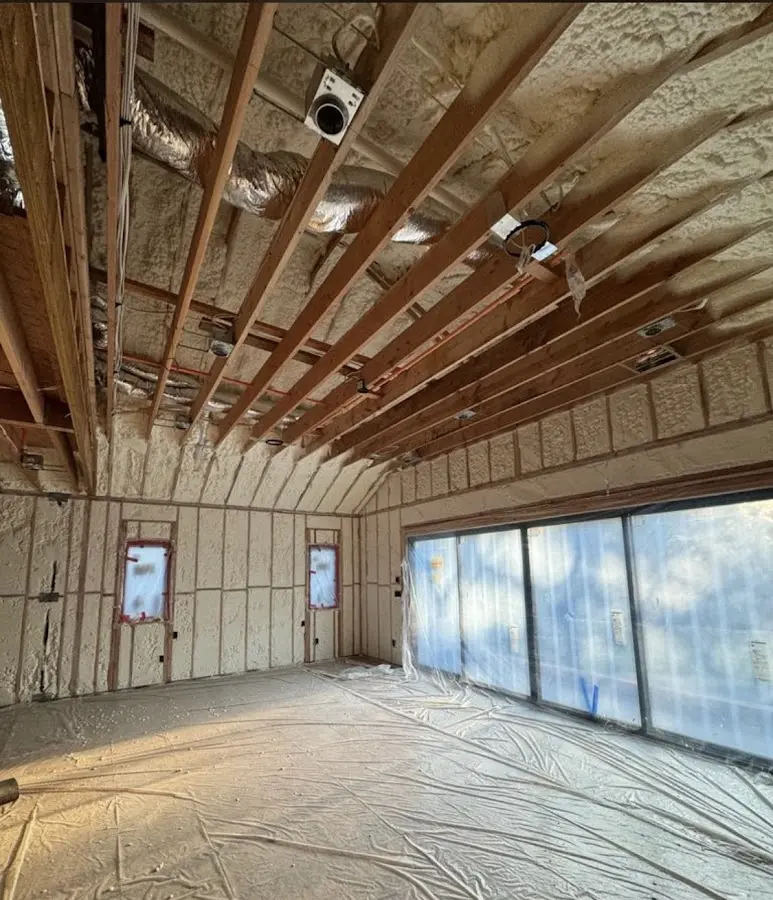 Interior walls and ceiling insulated with spray foam during new construction in Walnut Park